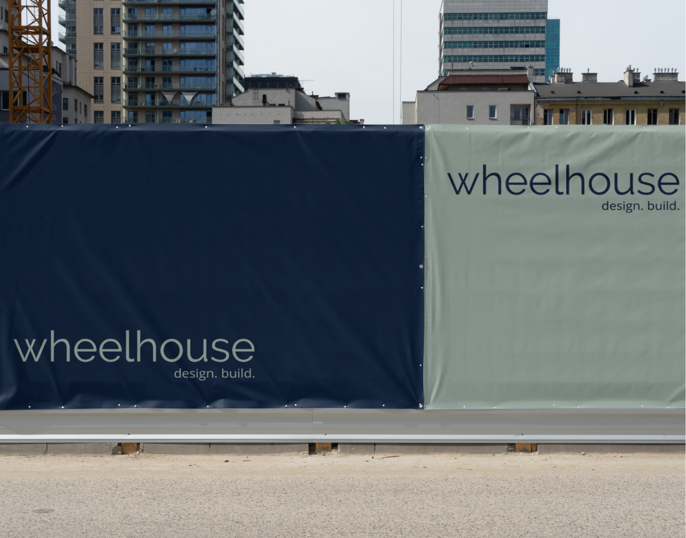 A construction side with wheelhouse design and build logo on it