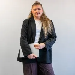 Marketing Official Marketing Official holding a laptop